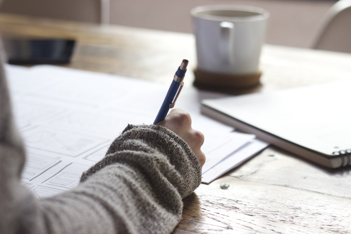 Student studying with books and notes